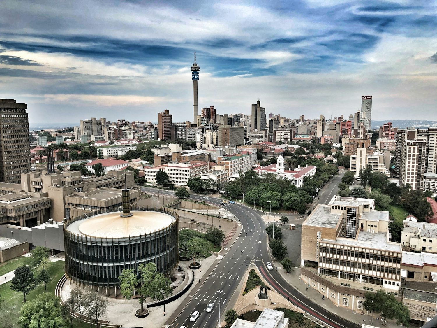 The Johannesburg skyline under a cloudy sky